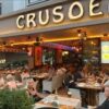 Crusoe Restaurant Steak House Cafe Bar’da deniz manzarası eşliğinde et ve dünya mutfağı lezzetleri.
