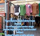 Tuğra Giyim Alanya – Kadın ve erkek giyiminde kaliteli, şık ve modern tasarımların yer aldığı mağaza vitrini.