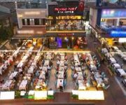 Picasso Port À La Carte Restaurant’ta deniz manzaralı şık akşam yemeği ambiyansı.