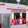 “TotalEnergies Quartz Auto Services – Özel Başarı Oto servis alanında bakım ve onarım işlemi yapılan aracın bulunduğu modern oto servis görüntüsü.”