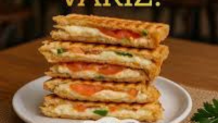 Sanayi Tostçu Selma Alanya’da servis edilen bol malzemeli, çift kat kaşarlı tost ve yanında çıtır patates kızartması ile ayran sunumu